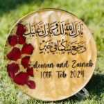 7.2-inch personalized resin wedding plate with Arabic calligraphy and rose petals.