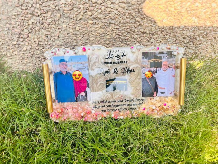 12×7 personalized resin Umrah Mubarak plaque with two custom photos, gold accents, floral resin detailing, Islamic calligraphy, and a heartfelt dua.