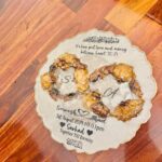A 3D Gajra preservation resin art piece featuring real dried flowers arranged in a heart shape with personalized details, symbolizing eternal love and tradition.